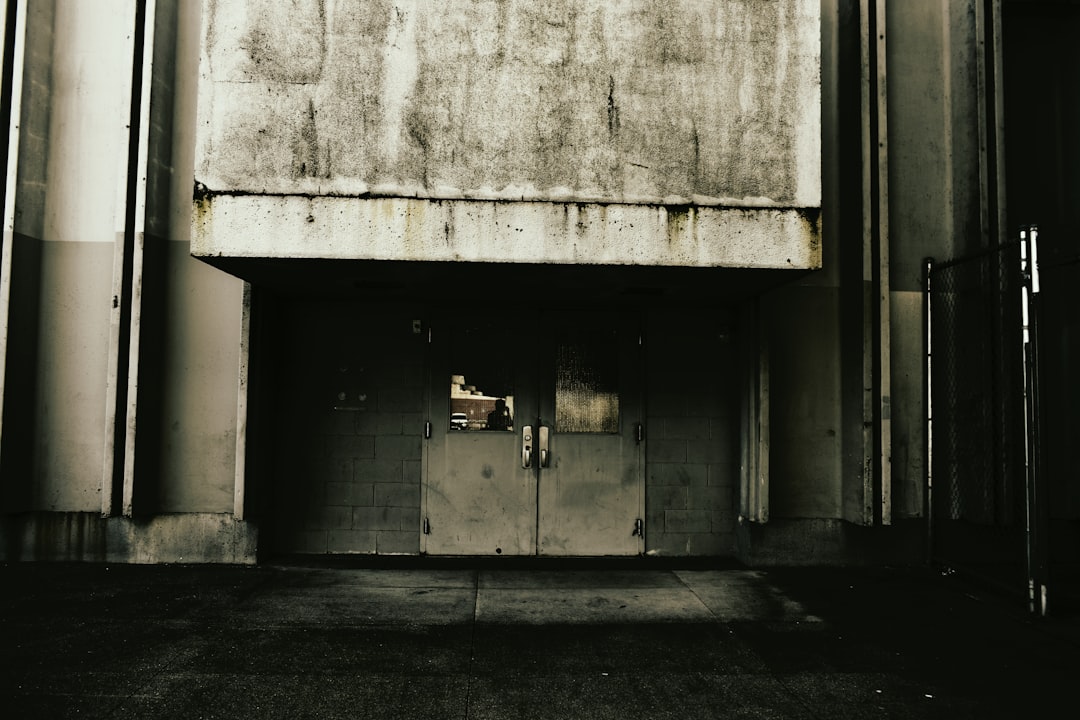 Guildford, Surrey: Concrete structure with dark entrance doors.